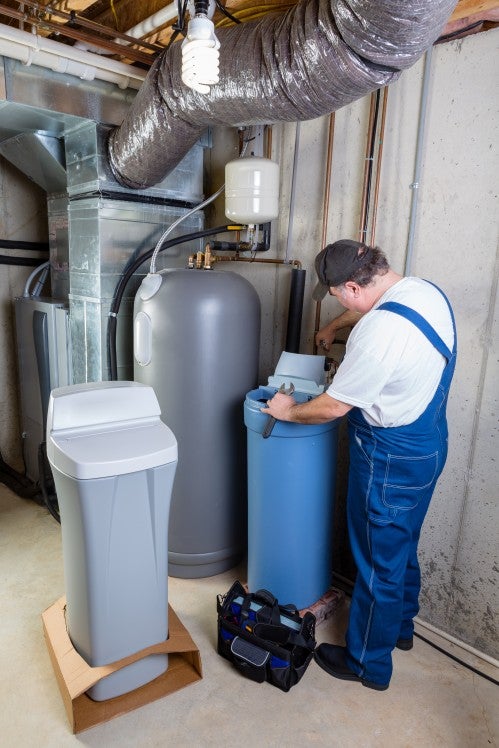 Professional Installing a Water Softener System to Reduce Hard Water Minerals in Jacksonville, FL