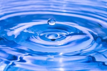 Water Droplet Forming a Ripple in Jacksonville, FL